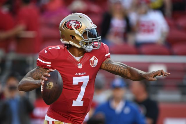 Colin Kaepernick Sits During National Anthem