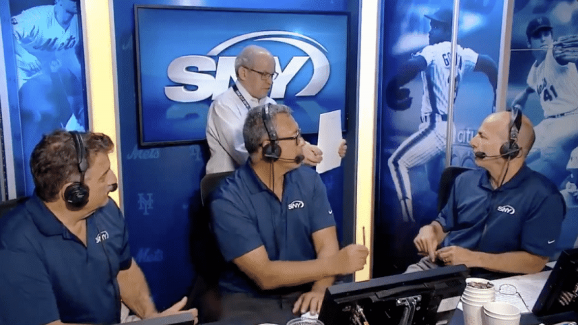 New York Mets staffer interrupts live shot to correct broadcast booth (Video)