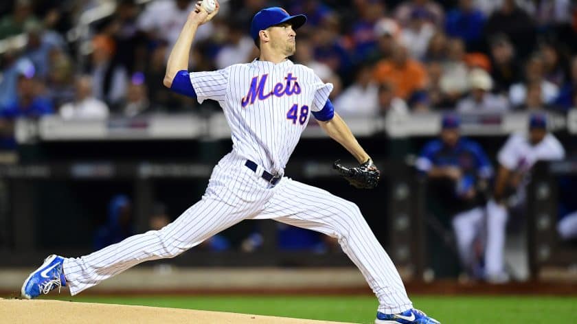 New York Mets RHP Jacob deGrom signs a baseball for Marlins rookie Tyler Heineman