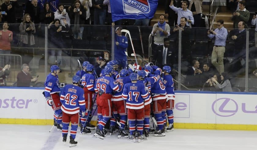 New York Rangers celebrate a 3-2 overtime win over the Minnesota Wild.