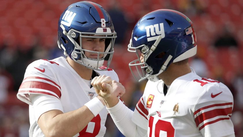 New York Giants quarterback Daniel Jones (8) and quarterback Eli Manning (10) talk while working out prior to an NFL football game against the Washington Redskins, Sunday, Dec. 22, 2019, in Landover, Md.