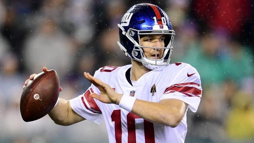 PHILADELPHIA, PENNSYLVANIA - DECEMBER 09: Quarterback Eli Manning #10 of the New York Giants drops back to pass over the defense of the Philadelphia Eagles during the game at Lincoln Financial Field on December 09, 2019 in Philadelphia, Pennsylvania.