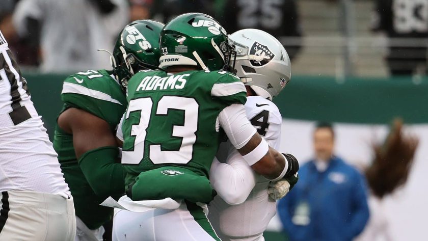 EAST RUTHERFORD, NEW JERSEY - NOVEMBER 24: Jamal Adams #33 of the New York Jets sacks Derek Carr #4 of the Oakland Raiders during their game at MetLife Stadium on November 24, 2019 in East Rutherford, New Jersey.