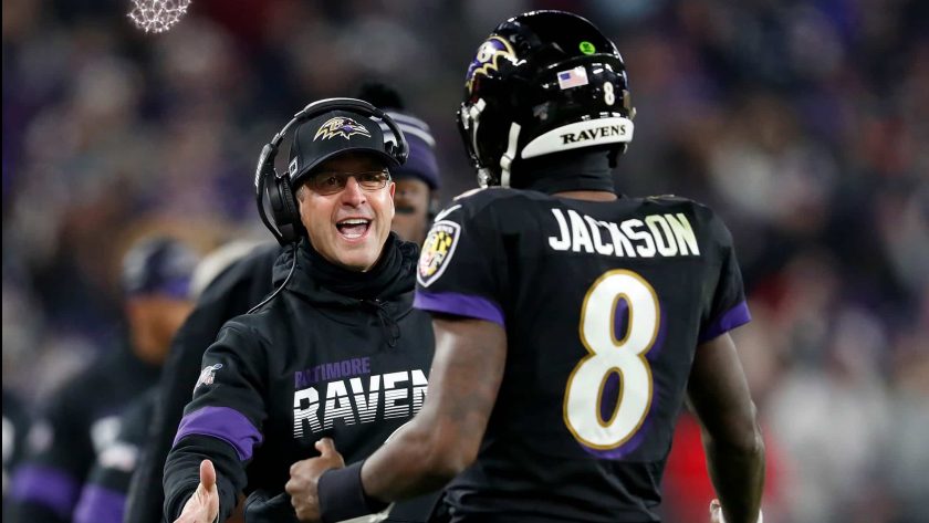 BALTIMORE, MARYLAND - DECEMBER 12: Head coach John Harbaugh of the Baltimore Ravens and quarterback Lamar Jackson #8 celebrate a touchdown in the third quarter of the game against the New York Jets at M&T Bank Stadium on December 12, 2019 in Baltimore, Maryland.