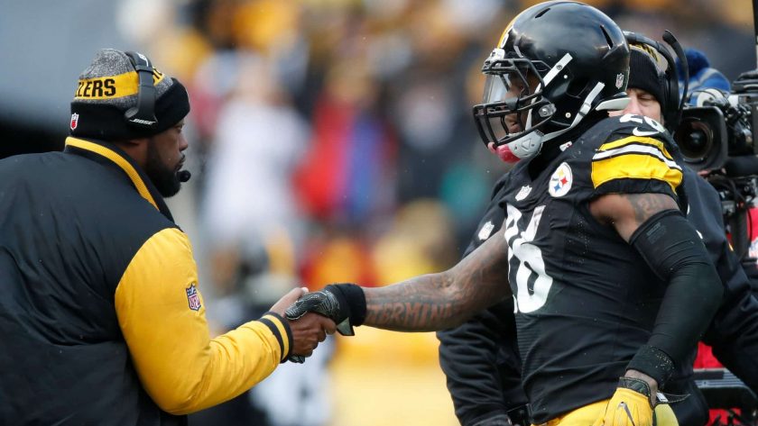 PITTSBURGH, PA - JANUARY 08: Le'Veon Bell #26 of the Pittsburgh Steelers celebrates with head coach Mike Tomlin after scoring a touchdown during the second quarter against the Miami Dolphins in the AFC Wild Card game at Heinz Field on January 8, 2017 in Pittsburgh, Pennsylvania.