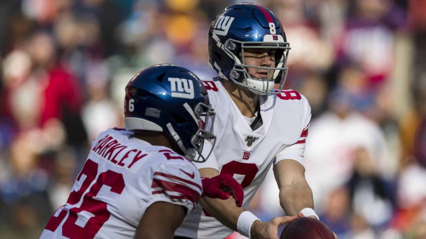 LANDOVER, MD - DECEMBER 22: Daniel Jones #8 of the New York Giants hands the ball off to Saquon Barkley #26 during the first half of the game against the Washington Redskins at FedExField on December 22, 2019 in Landover, Maryland.