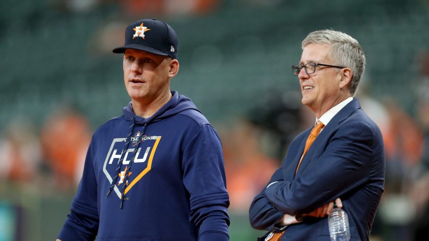 HOUSTON, TEXAS - OCTOBER 05: Manager AJ Hinch #14 talks with Jeff Luhnow, General Manager of the Houston Astros, prior to game two of the American League Division Series against the Tampa Bay Rays at Minute Maid Park on October 05, 2019 in Houston, Texas.