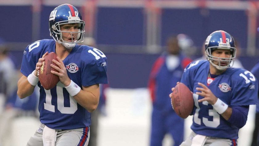 EAST RUTHERFORD, NJ - NOVEMBER 21: Eli Manning #10 and Kurt Warner #13 of the New York Giants drop back to pass during warm ups before their game against the Atlanta Falcons at Giant Stadium on November 21, 2004 in East Rutherford, New Jersey.