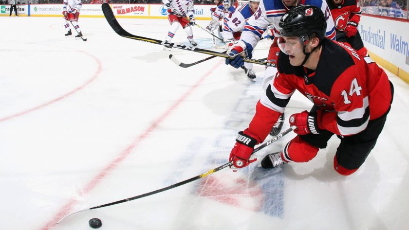 NEWARK, NEW JERSEY - SEPTEMBER 20: Steven Fogarty #29 of the New York Rangers checks Joey Anderson #14 of the New Jersey Devils in the corner during the second period at the Prudential Center on September 20, 2019 in Newark, New Jersey.