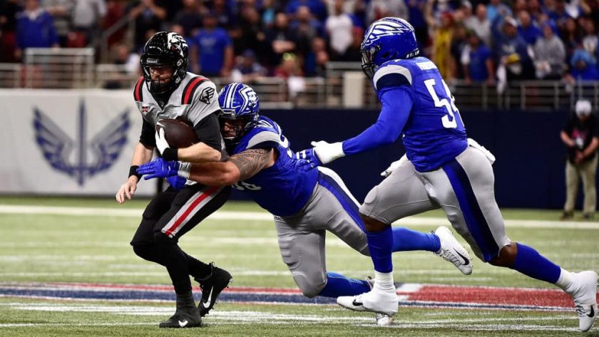 ST LOUIS, MO - FEBRUARY 23: Matt McGloin #14 of the NY Guardians is sacked by Casey Sayles #90 of the St. Louis Battlehawks during the first half of an XFL game at The Dome at America Center on February 23, 2020 in St Louis, Missouri.