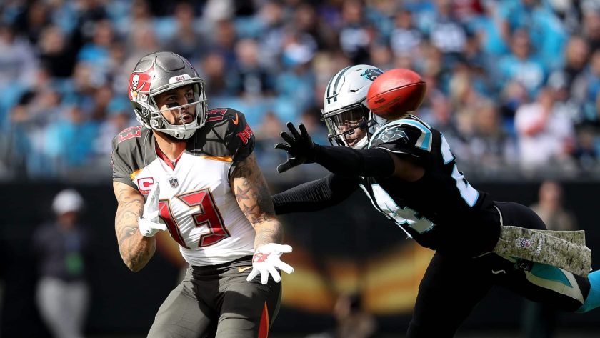CHARLOTTE, NC - NOVEMBER 04: James Bradberry #24 of the Carolina Panthers defends a pass to Mike Evans #13 of the Tampa Bay Buccaneers in the second quarter during their game at Bank of America Stadium on November 4, 2018 in Charlotte, North Carolina.