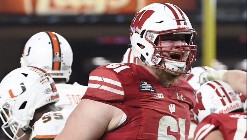 NEW YORK, NEW YORK - DECEMBER 27: Tyler Biadasz #61 of the Wisconsin Badgers reacts after the Badgers score a touchdown in the third quarter of the New Era Pinstripe Bowl against the Miami Hurricanes at Yankee Stadium on December 27, 2018 in the Bronx borough of New York City.