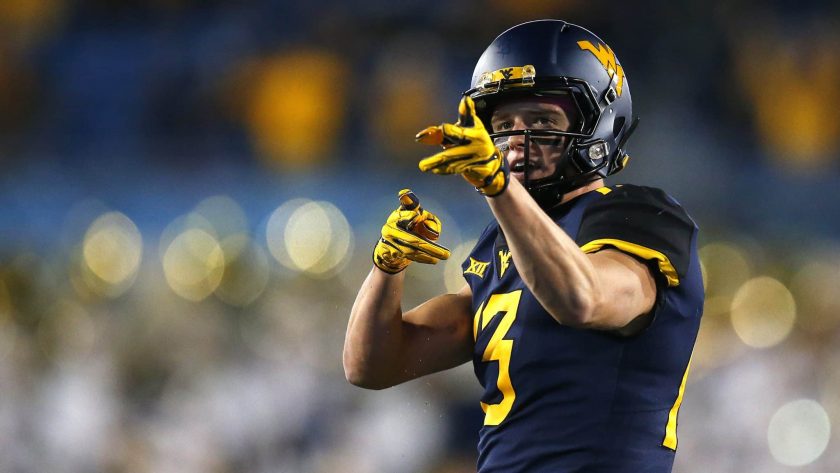 MORGANTOWN, WV - OCTOBER 25: David Sills V #13 of the West Virginia Mountaineers reacts after a first down in the first half against the Baylor Bears at Mountaineer Field on October 25, 2018 in Morgantown, West Virginia.