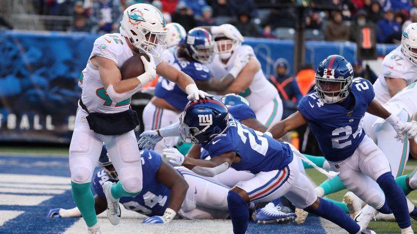 EAST RUTHERFORD, NEW JERSEY - DECEMBER 15: Patrick Laird #42 of the Miami Dolphins is tackled for a safety by Sam Beal #23 of the New York Giants in the third quarter during their game at MetLife Stadium on December 15, 2019 in East Rutherford, New Jersey.