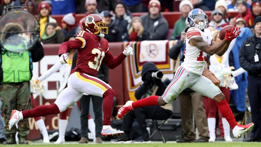 LANDOVER, MARYLAND - DECEMBER 09: Cornerback Fabian Moreau #31 of the Washington Redskins looks on as wide receiver Corey Coleman #19 catches a first half pass at FedExField on December 09, 2018 in Landover, Maryland.