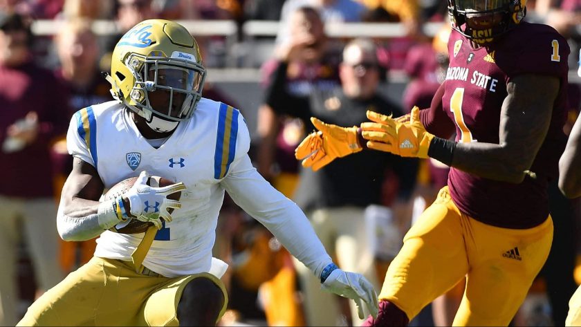 TEMPE, AZ - NOVEMBER 10: Defensive back Darnay Holmes #1 of the UCLA Bruins makes an interception and runs the football 31 yards for a touchdown in the first half against the Arizona State Sun Devils at Sun Devil Stadium on November 10, 2018 in Tempe, Arizona.