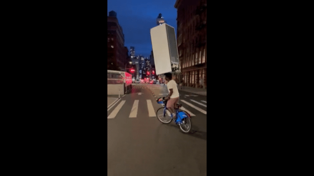 WATCH: NYC cyclist can ride while balancing a fridge on his head