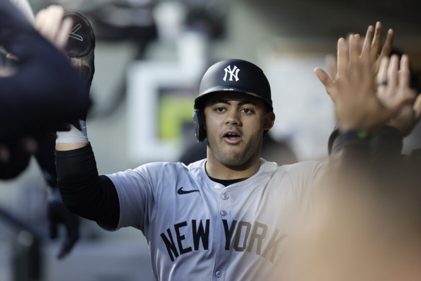 Yankees defeat Mariners 2-1 in extra innings, clinch playoff spot