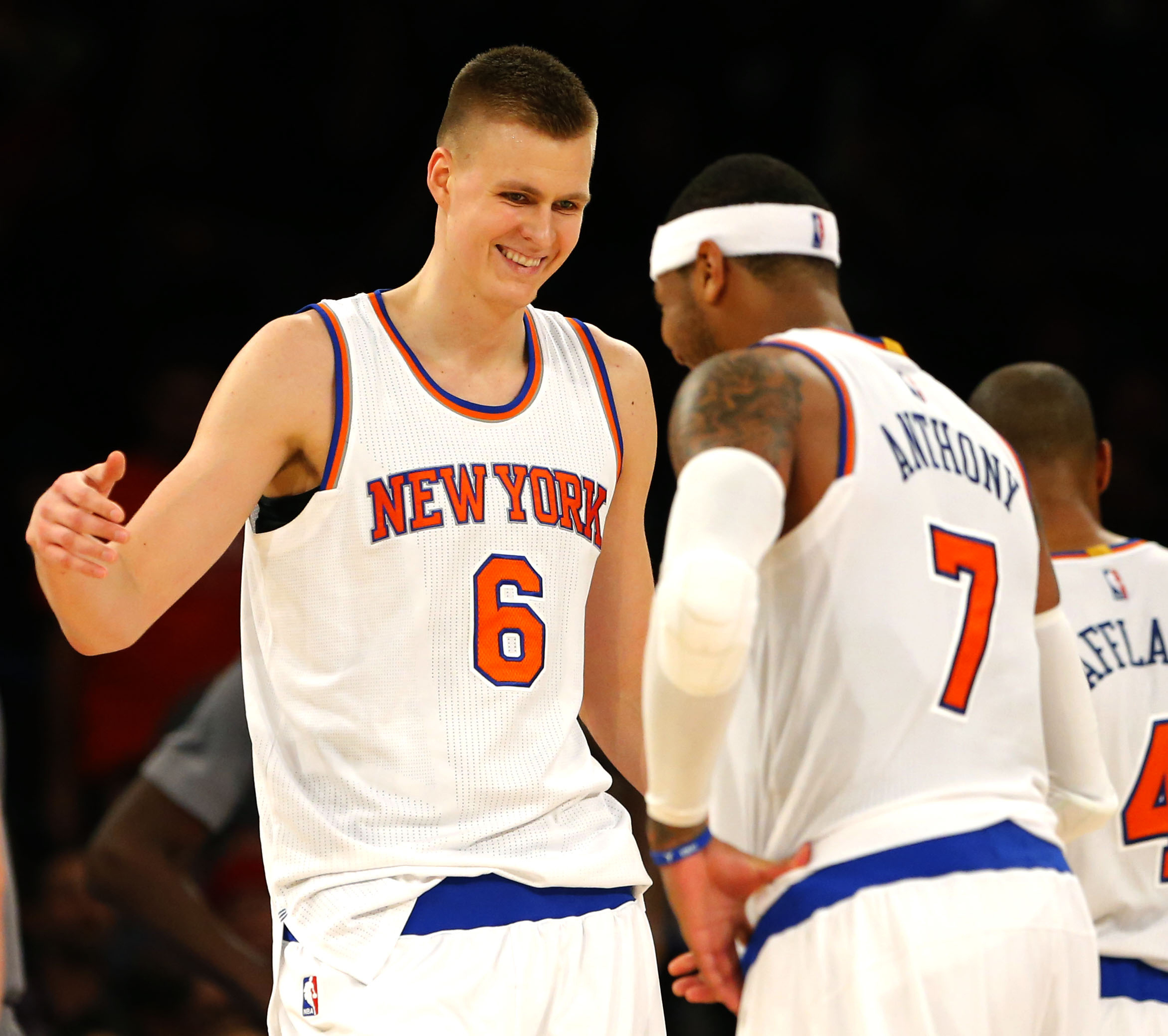 Dec 19, 2015; New York, NY, USA; New York Knicks forward Kristaps Porzingis (6) and New York Knicks forward Carmelo Anthony (7) react after a shot by Porzingis (6) during second half against the Chicago Bulls at Madison Square Garden. The New York Knicks defeated the Chicago Bulls 107-91. Mandatory Credit: Noah K. Murray-USA TODAY Sports