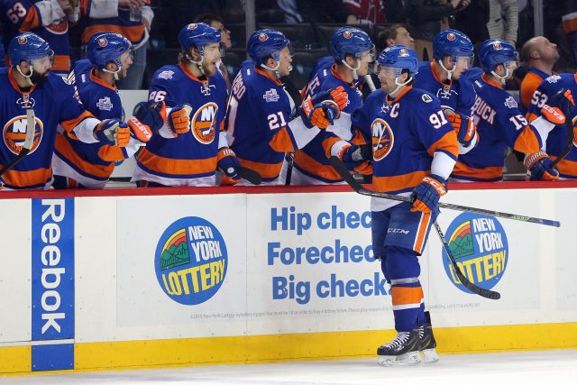Feb 18, 2016; Brooklyn, NY, USA; New York Islanders center John Tavares (91) celebrates his goal against the Washington Capitals with teammates during the first period at Barclays Center. Mandatory Credit: Brad Penner-USA TODAY Sports