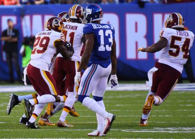 Sep 25, 2016; East Rutherford, NJ, USA; Washington Redskins players celebrate after a last minute interception in front of New York Giants wide receiver Odell Beckham (13) at MetLife Stadium. Mandatory Credit: Robert Deutsch-USA TODAY Sports