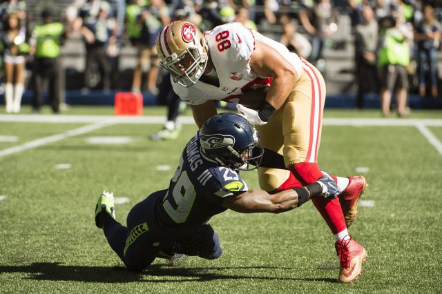 Sep 25, 2016; Seattle, WA, USA;  Seattle Seahawks free safety Earl Thomas (29) tackles San Francisco 49ers tight end Garrett Celek (88) during the second quarter at CenturyLink Field. Mandatory Credit: Troy Wayrynen-USA TODAY Sports