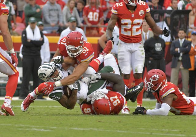 Sep 25, 2016; Kansas City, MO, USA; New York Jets wide receiver Jalin Marshall (89) is tackled by Kansas City Chiefs defensive end Allen Bailey (97) and outside linebacker Frank Zombo (51) during the second half at Arrowhead Stadium. The Chiefs won 24-3. Mandatory Credit: Denny Medley-USA TODAY Sports