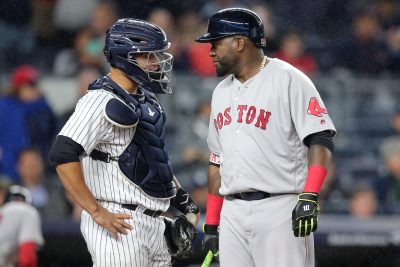 Sep 28, 2016; Bronx, NY, USA; New York Yankees catcher Gary Sanchez (24) talks to Boston Red Sox designated hitter David Ortiz (34) during the eighth inning at Yankee Stadium. Ortiz was intentionally walked in the at-bat. Mandatory Credit: Brad Penner-USA TODAY Sports