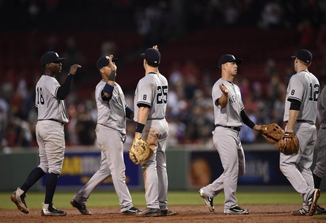 Aug 10, 2016; Boston, MA, USA; New York Yankees celebrate their victory over the Boston Red Sox at Fenway Park. Mandatory Credit: Bob DeChiara-USA TODAY Sports