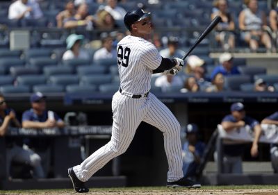 Aug 13, 2016; Bronx, NY, USA; New York Yankees right fielder Aaron Judge (99) watches a solo home run during the second inning against the Tampa Bay Rays at Yankee Stadium. Mandatory Credit: Adam Hunger-USA TODAY Sports