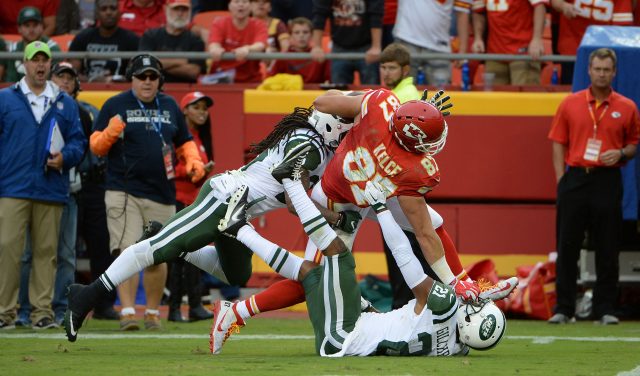 Sep 25, 2016; Kansas City, MO, USA; Kansas City Chiefs tight end Travis Kelce (87) is tackled by New York Jets free safety <a rel=