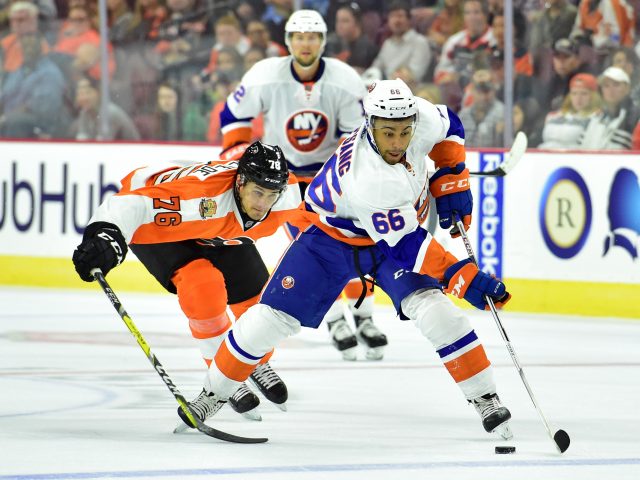 Sep 27, 2016; Philadelphia, PA, USA; New York Islanders right wing Josh Ho-Sang (66) carries the puck past Philadelphia Flyers center Chris VandeVelde (76) during the second period during a preseason hockey game at Wells Fargo Center. Mandatory Credit: Eric Hartline-USA TODAY Sports