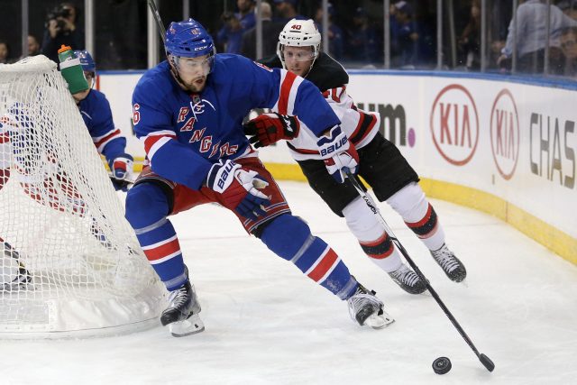 Sep 29, 2016; New York, NY, USA; New York Rangers defenseman Dylan McIlrath (6) plays the puck against New Jersey Devils center Blake Coleman (40) during the second period of a preseason hockey game at Madison Square Garden. Mandatory Credit: Brad Penner-USA TODAY Sports