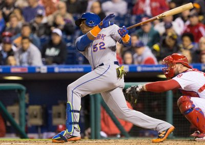 Sep 30, 2016; Philadelphia, PA, USA; New York Mets left fielder Yoenis Cespedes (52) hits a single in front of Philadelphia Phillies catcher Cameron Rupp (29) during the fourth inning at Citizens Bank Park. Mandatory Credit: Bill Streicher-USA TODAY Sports
