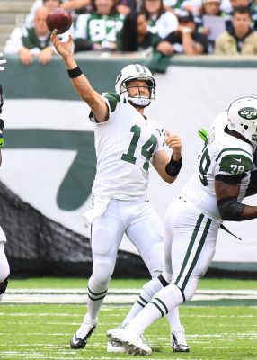 Oct 2, 2016; East Rutherford, NJ, USA; New York Jets quarterback Ryan Fitzpatrick (14) throws for a 1st down in the second quarter at MetLife Stadium. Mandatory Credit: Robert Deutsch-USA TODAY Sports