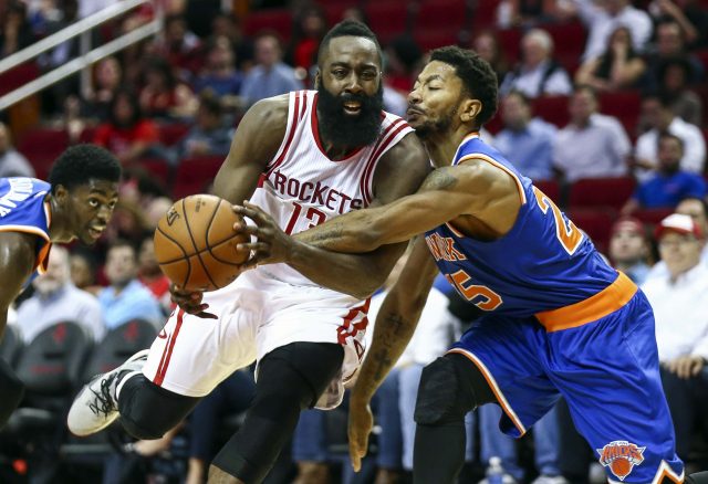 Oct 4, 2016; Houston, TX, USA; New York Knicks guard Derrick Rose (25) attempts to steal the ball from Houston Rockets guard James Harden (13) during the second quarter at Toyota Center. Mandatory Credit: Troy Taormina-USA TODAY Sports