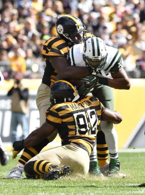 Oct 9, 2016; Pittsburgh, PA, USA; New York Jets running back Matt Forte (22) is tackled by Pittsburgh Steelers outside linebacker James Harrison (92) and nose tackle Javon Hargrave (79) during the second quarter at Heinz Field against the New York Jets. Mandatory Credit: Mark Konezny-USA TODAY Sports