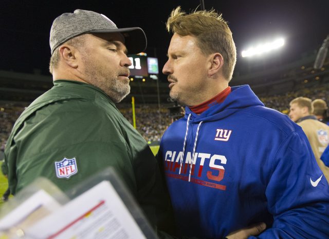 Oct 9, 2016; Green Bay, WI, USA; Green Bay Packers head coach Mike McCarthy talks with New York Giants head coach Ben McAdoo following the game at Lambeau Field. Green Bay won 23-16. Mandatory Credit: Jeff Hanisch-USA TODAY Sports