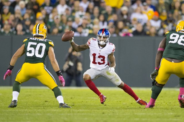 Oct 9, 2016; Green Bay, WI, USA;  New York Giants wide receiver Odell Beckham Jr. (13) rushes with the football as Green Bay Packers linebacker Blake Martinez (50) defends during the third quarter at Lambeau Field.  Green Bay won 23-16.  Mandatory Credit: Jeff Hanisch-USA TODAY Sports