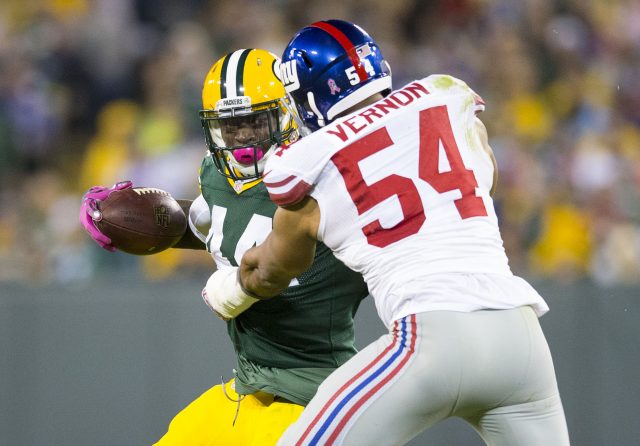 Oct 9, 2016; Green Bay, WI, USA; Green Bay Packers running back James Starks (44) is tackled by New York Giants defensive end Olivier Vernon (54) during the fourth quarter at Lambeau Field. Green Bay won 23-16. Mandatory Credit: Jeff Hanisch-USA TODAY Sports