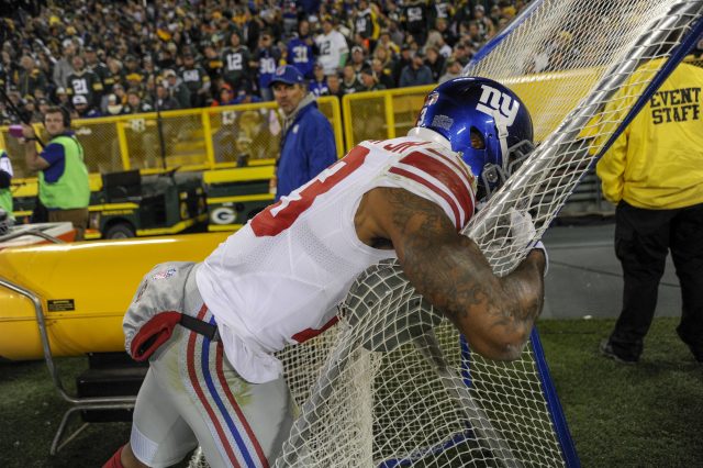 Oct 9, 2016; Green Bay, WI, USA; New York Giants wide receiver Odell Beckham Jr. (13) reacts after his touchdown catch was upheld in the fourth quarter during the game against the Green Bay Packers at Lambeau Field. Mandatory Credit: Benny Sieu-USA TODAY Sports