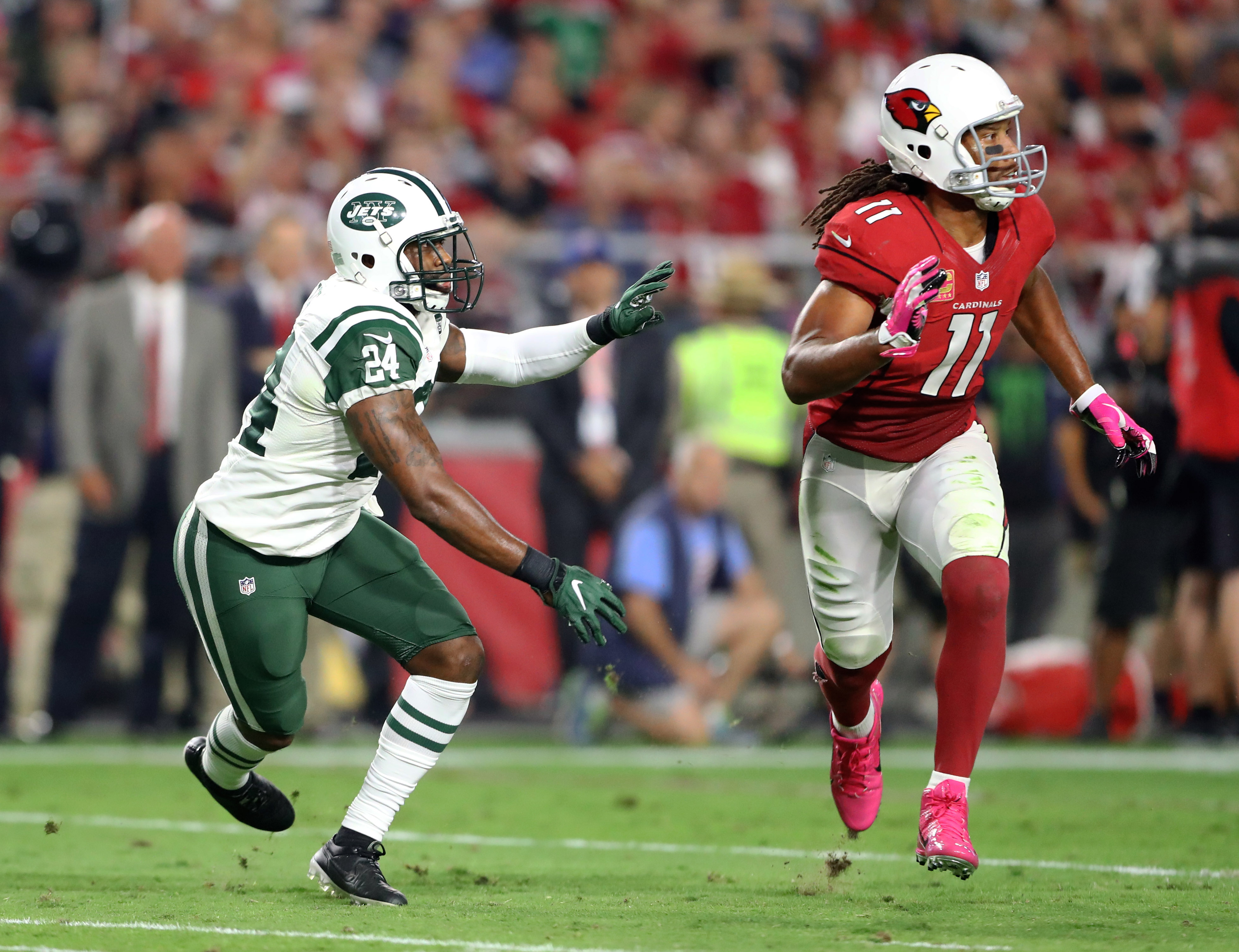 Seattle Seahawks wide receiver Sidney Rice (18) celebrates his touchdown  with Jermaine Kearse, right, as Arizona Cardinals strong safety Yeremiah  Bell, rear, walks away during the first half of an NFL football