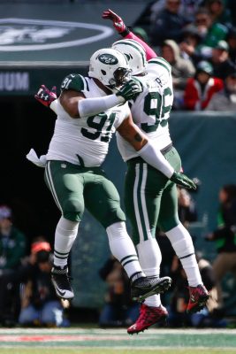 Jets star defensive linemen Sheldon Richardson (left) and Muhammad Wilkerson (right) celebrate after a big play. Credit - Vincent Carchietta-USATSI