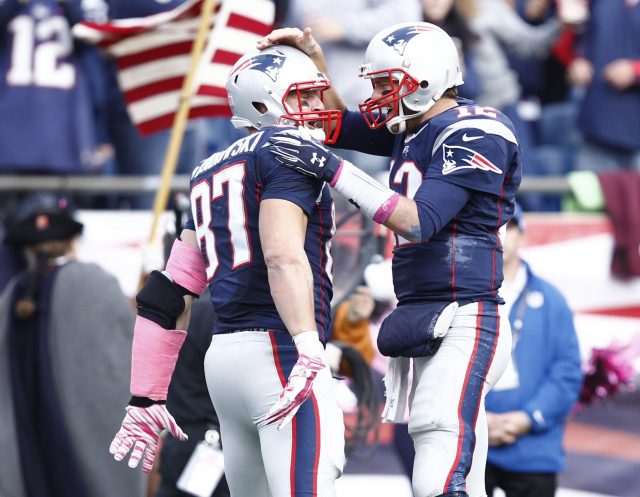 New England Patriots tight end Rob Gronkowski (87) is tripped up by Miami  Dolphins cornerback Will Allen (25) on a 9-yard reception in the fourth  quarter at Gillette Stadium in Foxboro, Massachusetts