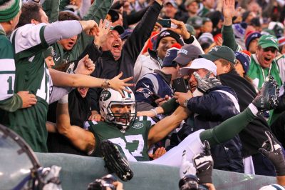 Dec 27, 2015; East Rutherford, NJ, USA; New York Jets wide receiver Eric Decker (87) celebrates his game winning touchdown pass from New York Jets quarterback Ryan Fitzpatrick (14) (not shown) during overtime at MetLife Stadium. The Jets defeated the Patriots 26-20. Mandatory Credit: Ed Mulholland-USA TODAY Sports