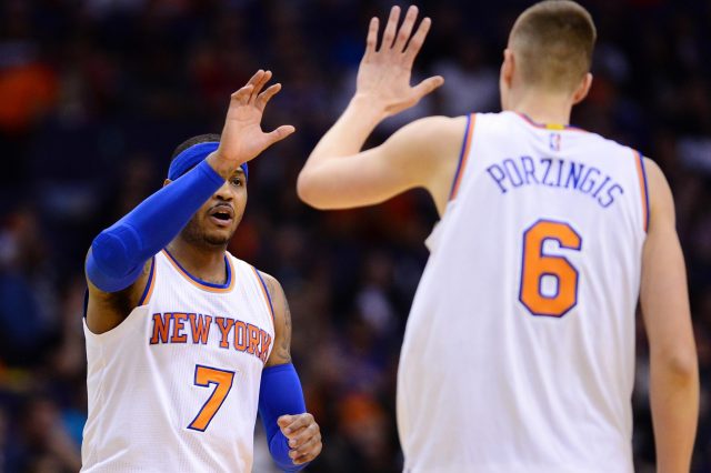 Mar 9, 2016; Phoenix, AZ, USA; New York Knicks forward Carmelo Anthony (7) high fives forward Kristaps Porzingis (6) in the first half against the Phoenix Suns at Talking Stick Resort Arena. Mandatory Credit: Jennifer Stewart-USA TODAY Sports