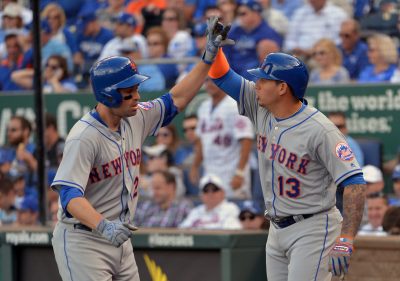 Apr 5, 2016; Kansas City, MO, USA; New York Mets second baseman Neil Walker (20) is congratulated by shortstop Asdrubal Cabrera (13) after Walker hits a two run home run in the fourth inning against the Kansas City Royals at Kauffman Stadium. Mandatory Credit: Denny Medley-USA TODAY Sports