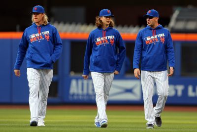 May 20, 2016; New York City, NY, USA; New York Mets starting pitcher Noah Syndergaard (34) and New York Mets starting pitcher Jacob deGrom (48) and New York Mets starting pitcher Matt Harvey (33) walk in from the bullpen before the first inning against the Milwaukee Brewers at Citi Field. Mandatory Credit: Brad Penner-USA TODAY Sports