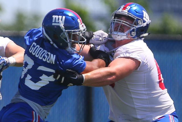 Jun 6, 2016; East Rutherford, NJ, USA; New York Giants linebacker B.J. Goodson (93) rushes New York Giants center Brett Jones (69) during organized team activities at Quest Diagnostics Training Center.  Mandatory Credit: Ed Mulholland-USA TODAY Sports