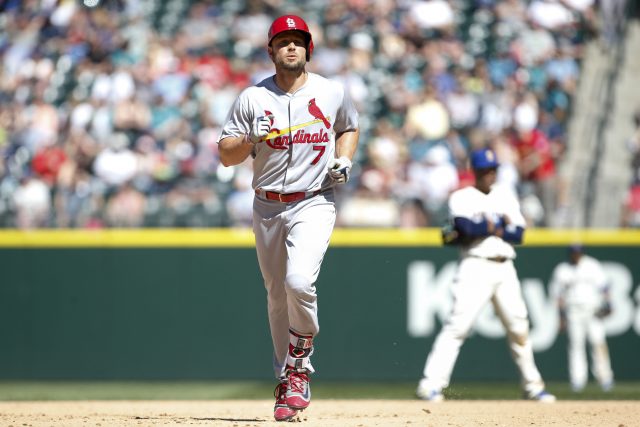 Jun 26, 2016; Seattle, WA, USA; St. Louis Cardinals designated hitter Matt Holliday (7) runs around the bases as Seattle Mariners second baseman Robinson Cano (R) reacts during the eighth inning at Safeco Field. The Cardinals won 11-6. Mandatory Credit: Jennifer Buchanan-USA TODAY Sports